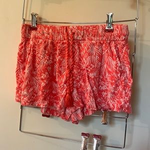coral/orange tropical print flowy shorts